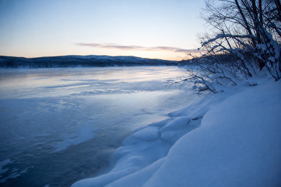 Snow-covered Finnish Lapland landscape in natural winter light