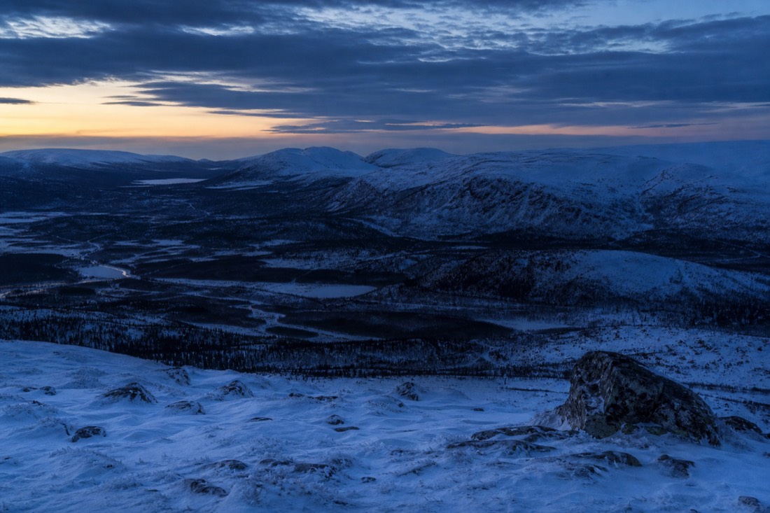 Blue hour over a Lapland valley, snow holding the last light